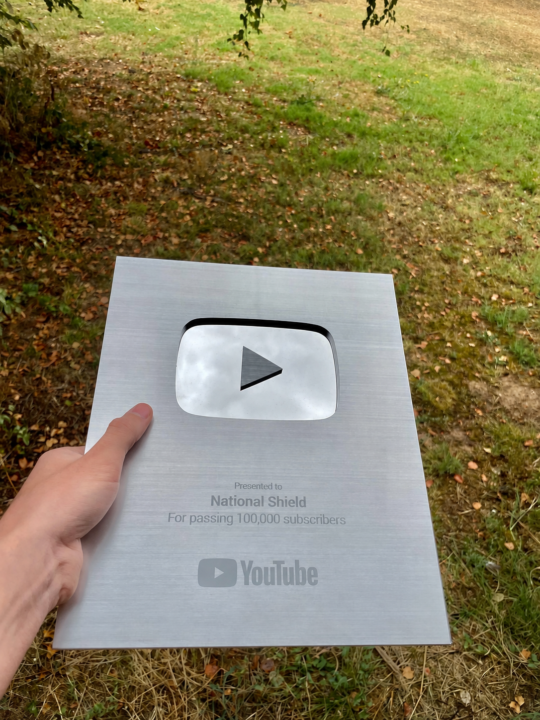 National Shield’s YouTube Silver Creator Award, presented for passing 100,000 subscribers